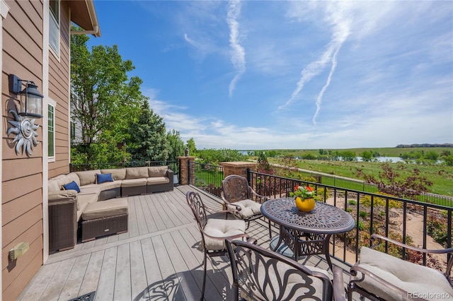 26741 E Arbor Dr, Aurora, CO 80016 - wooden terrace featuring an outdoor hangout area and a water view