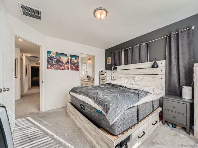 17991 E 103rd Ave, Commerce City, CO 80022 - carpeted bedroom with ensuite bathroom and baseboards