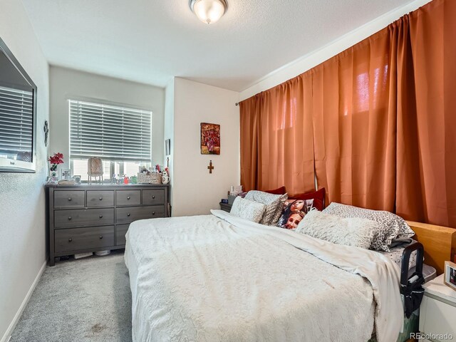 17991 E 103rd Ave, Commerce City, CO 80022 - bedroom with light colored carpet and baseboards