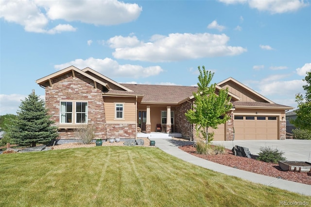 craftsman-style home featuring a garage and a front lawn