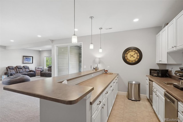 kitchen featuring white cabinetry, dishwasher, sink, hanging light fixtures, and kitchen peninsula