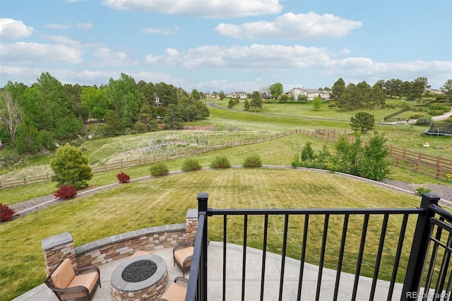 view of yard featuring a fire pit and a patio area