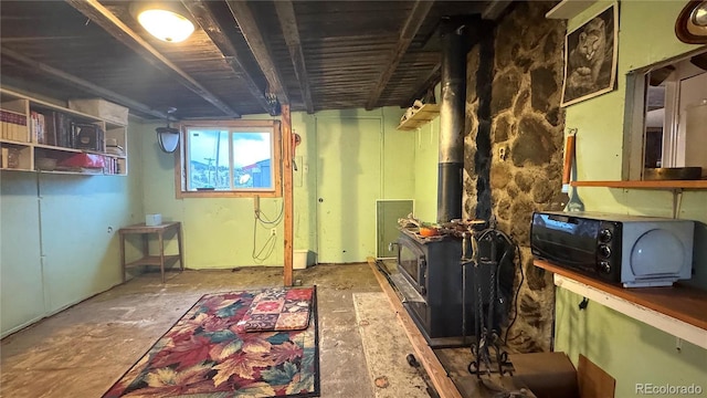 below grade area featuring a wood stove