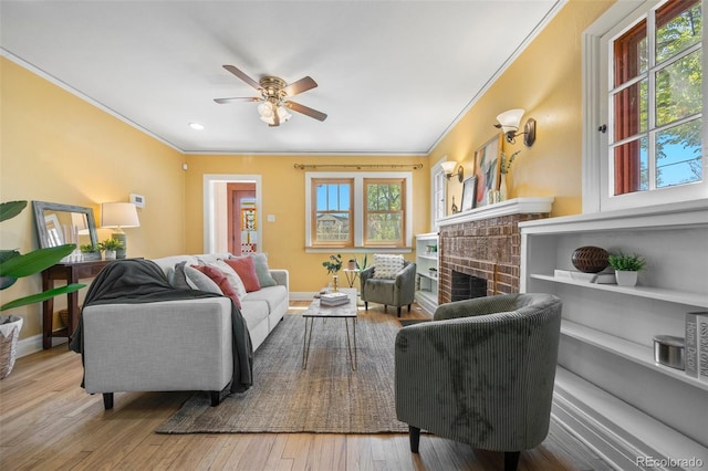 1601 Albion St, Denver, CO 80220 - living area with ornamental molding, a fireplace, ceiling fan, wood-type flooring, and baseboards
