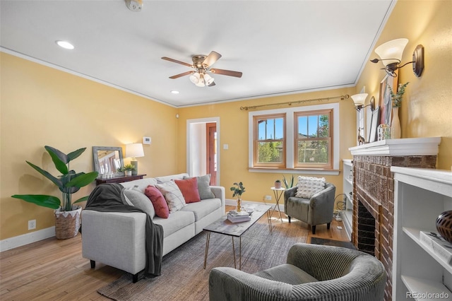 1601 Albion St, Denver, CO 80220 - living room with crown molding, wood finished floors, a ceiling fan, a fireplace, and baseboards