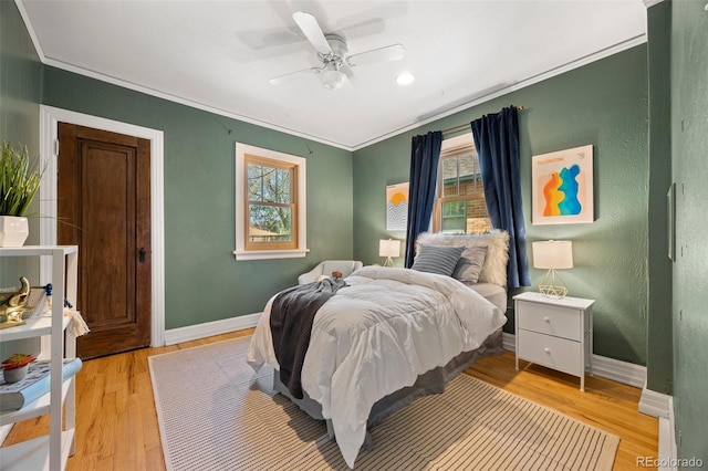 1601 Albion St, Denver, CO 80220 - bedroom with multiple windows, crown molding, light wood-style flooring, and baseboards