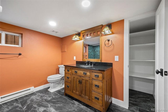 1601 Albion St, Denver, CO 80220 - bathroom with baseboard heating, baseboards, toilet, marble look tiles, and vanity