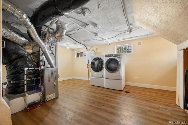 1601 Albion St, Denver, CO 80220 - laundry area with independent washer and dryer, baseboards, and wood finished floors