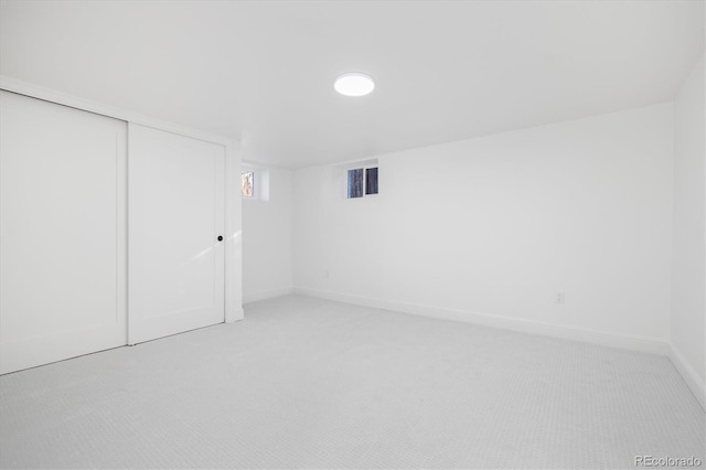 interior space with light colored carpet, visible vents, and baseboards