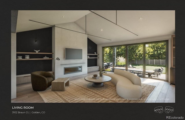 living room featuring lofted ceiling, hardwood / wood-style flooring, and a large fireplace