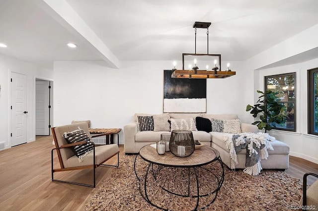7651 Robb St, Arvada, CO 80005 - living room featuring wood finished floors, recessed lighting, and beam ceiling