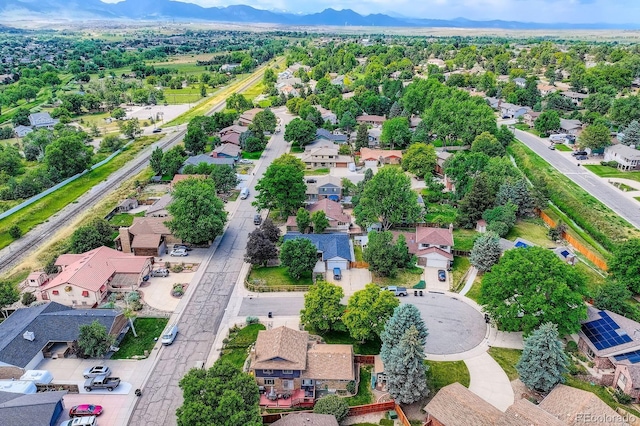 7651 Robb St, Arvada, CO 80005 - aerial perspective of suburban area featuring a mountainous background