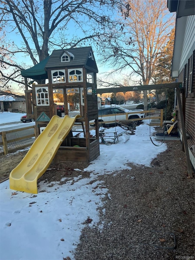 7651 Robb St, Arvada, CO 80005 - snow covered playground with a playground