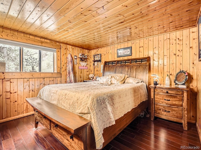 6837 S Brook Forest Rd, Evergreen, CO 80439 - bedroom with wood walls, wooden ceiling, and hardwood / wood-style floors