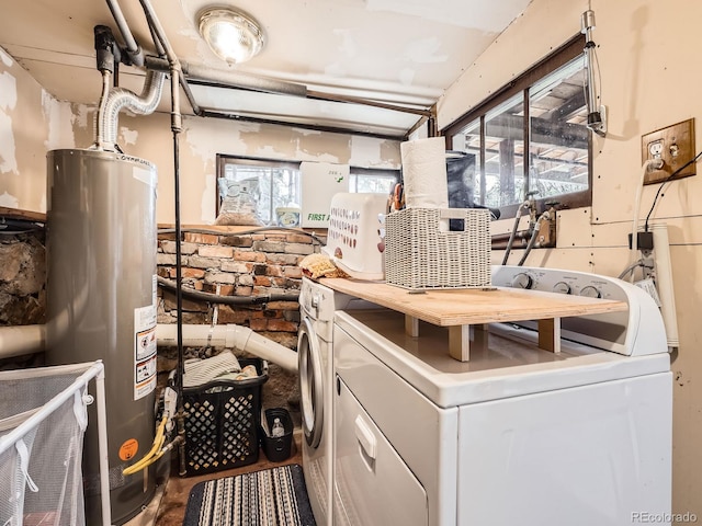 6837 S Brook Forest Rd, Evergreen, CO 80439 - washroom featuring gas water heater and washing machine and clothes dryer