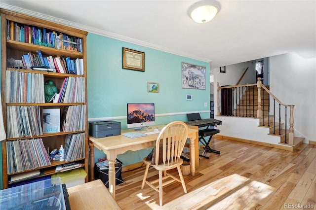 office featuring ornamental molding, baseboards, and wood finished floors