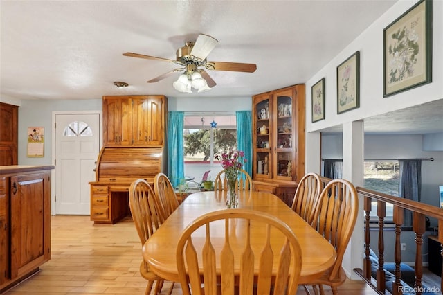 dining room featuring light wood-type flooring and ceiling fan