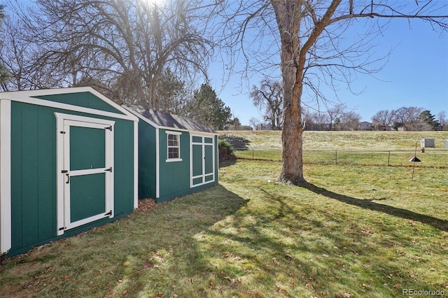 view of shed with fence