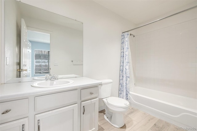 full bathroom featuring vanity, shower / tub combo with curtain, and toilet