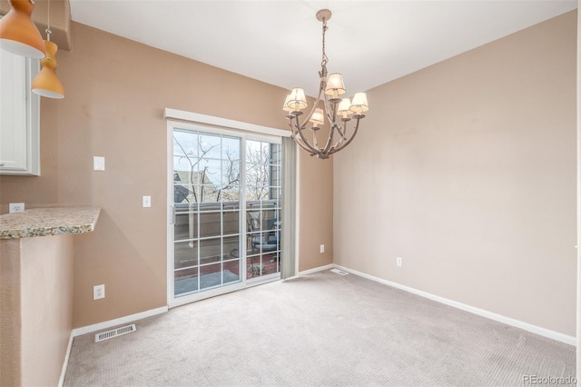 unfurnished dining area with light carpet and an inviting chandelier