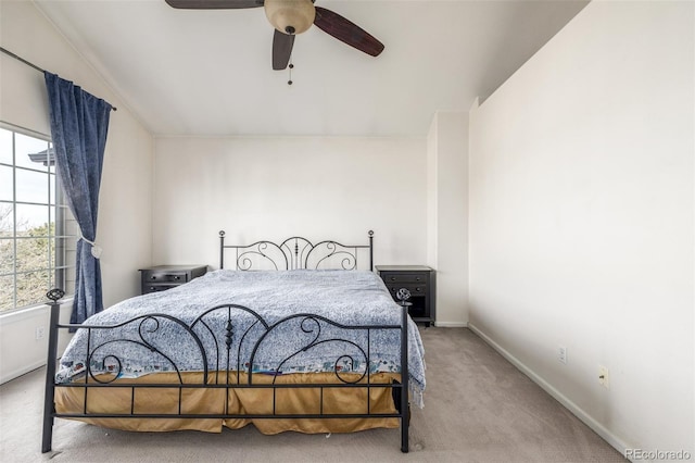 bedroom with light carpet and ceiling fan