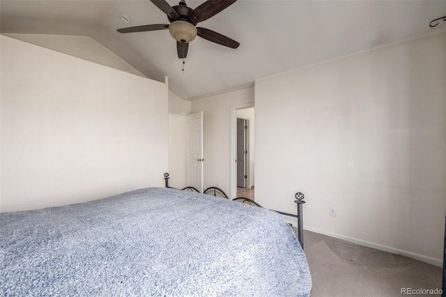 unfurnished bedroom featuring ceiling fan, lofted ceiling, and light carpet