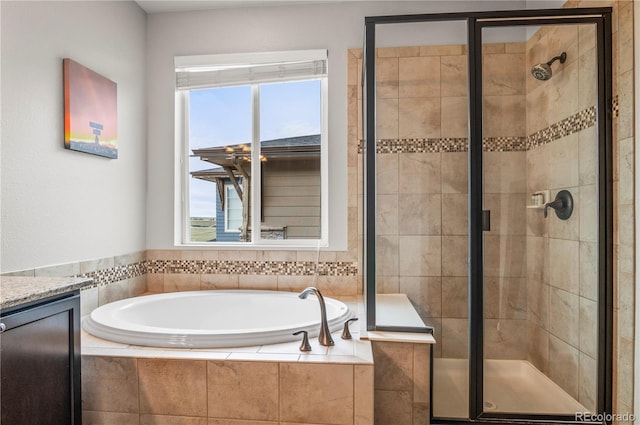 full bath featuring plenty of natural light, a shower stall, and a bath