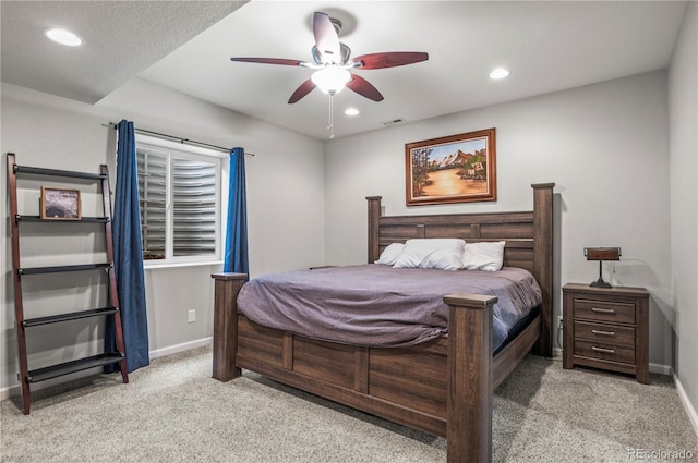 bedroom featuring light colored carpet, recessed lighting, baseboards, and ceiling fan