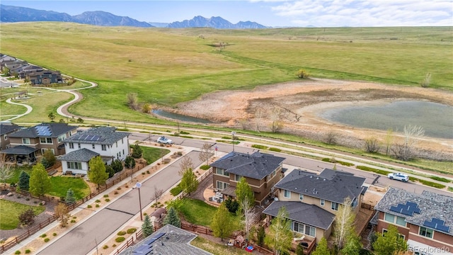 drone / aerial view featuring a residential view and a mountain view