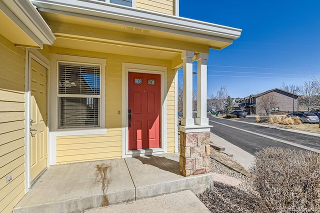 doorway to property featuring a residential view