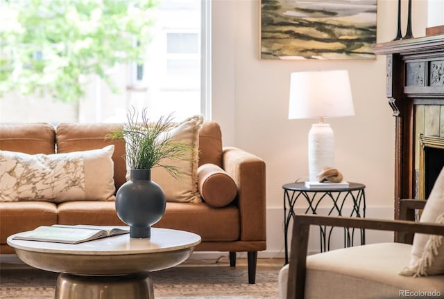 230 E Ellsworth Ave, Denver, CO 80209 - living area featuring wood finished floors and a tile fireplace