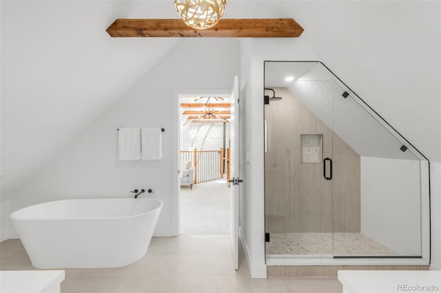 230 E Ellsworth Ave, Denver, CO 80209 - bathroom with lofted ceiling, a soaking tub, a stall shower, and tile patterned floors