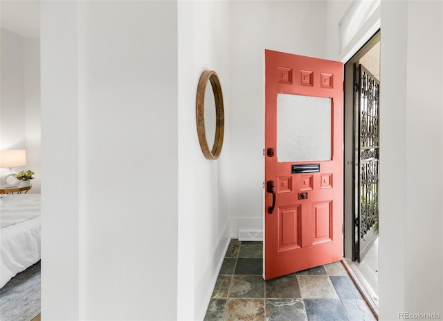 230 E Ellsworth Ave, Denver, CO 80209 - entrance foyer with stone finish flooring and baseboards
