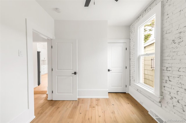 230 E Ellsworth Ave, Denver, CO 80209 - unfurnished bedroom featuring light wood-type flooring and a ceiling fan