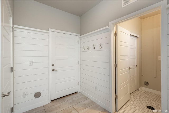 mudroom with light tile patterned floors