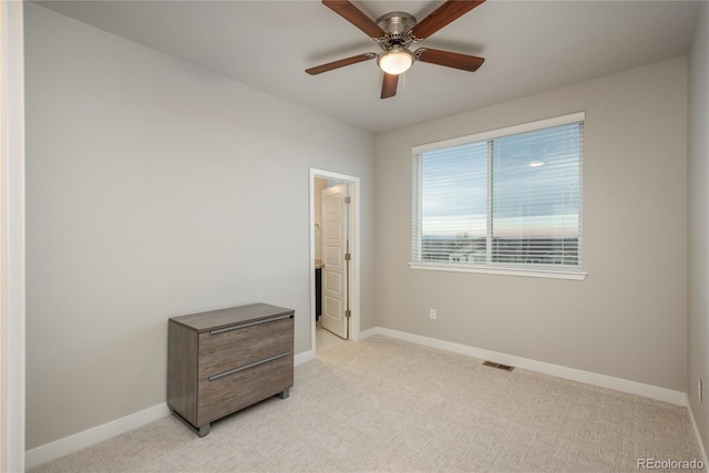 bedroom featuring ceiling fan and light carpet