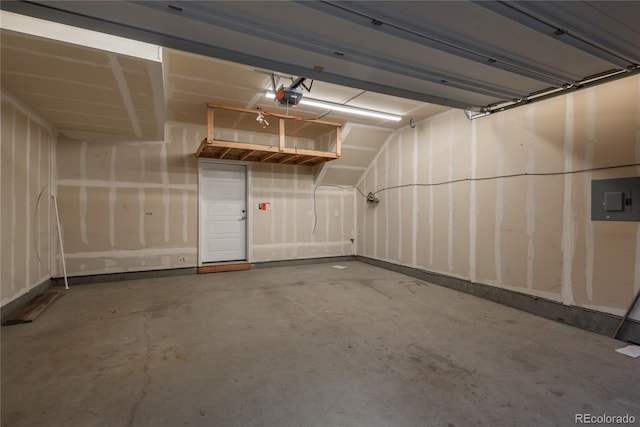 garage featuring a garage door opener and electric panel