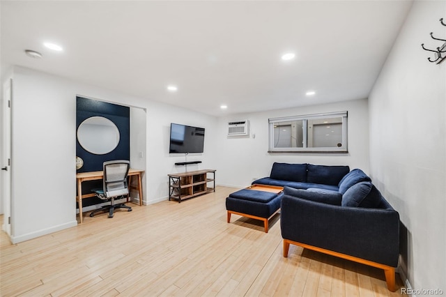 20 S Logan St Unit 104, Denver, CO 80209 - living room featuring a desk, recessed lighting, a wall mounted AC, wood finished floors, and baseboards