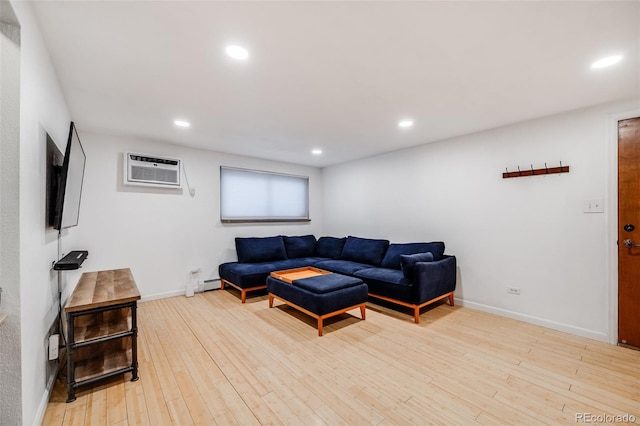20 S Logan St Unit 104, Denver, CO 80209 - living room featuring a wall unit AC, wood finished floors, recessed lighting, a baseboard radiator, and baseboards