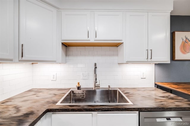 20 S Logan St Unit 104, Denver, CO 80209 - kitchen featuring dishwasher, a sink, butcher block countertops, and tasteful backsplash