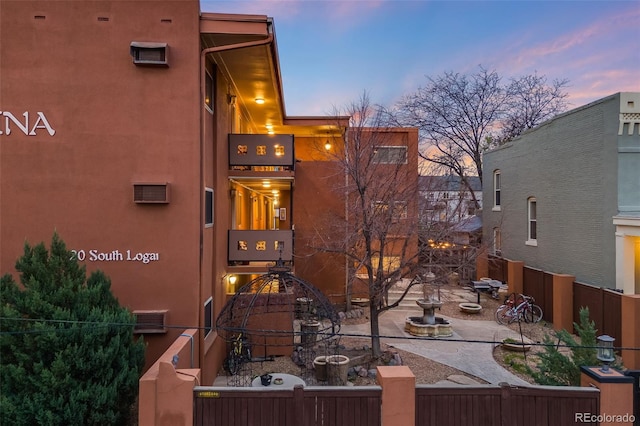 20 S Logan St Unit 104, Denver, CO 80209 - exterior entry at dusk featuring stucco siding