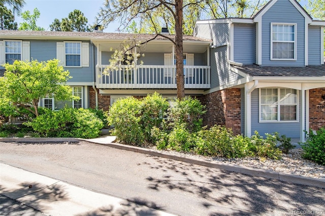 view of front of house featuring brick siding