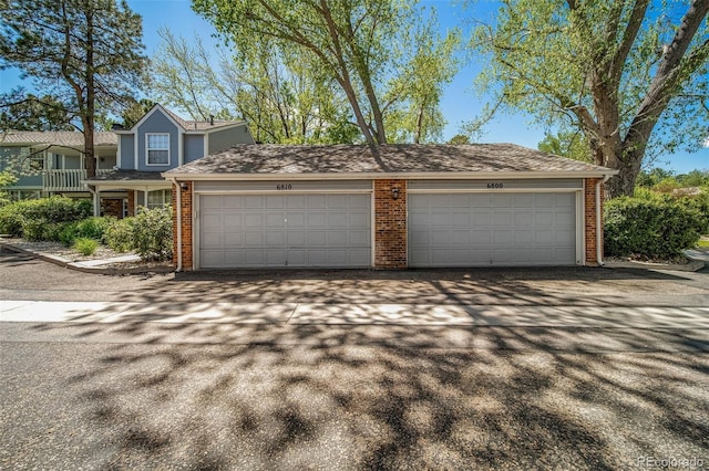 garage featuring driveway