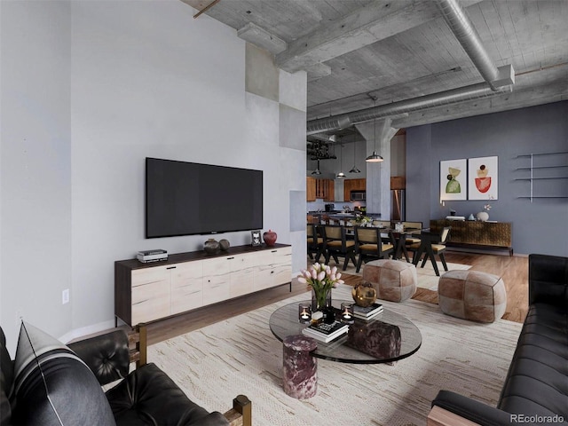 living room featuring wood finished floors and baseboards