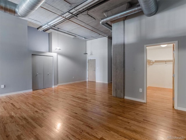 below grade area with wood finished floors and baseboards