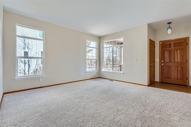 empty room with light colored carpet