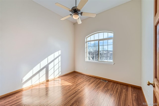 empty room featuring ceiling fan and wood-type flooring