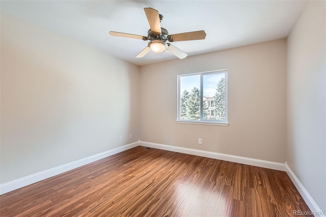 unfurnished room with ceiling fan and wood-type flooring