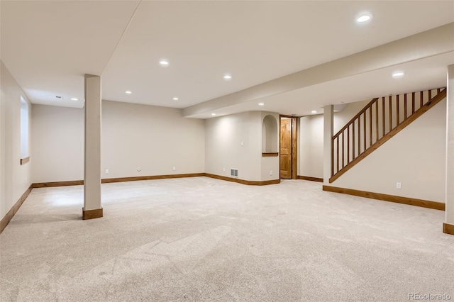 basement with light colored carpet