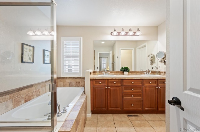 full bath with double vanity, visible vents, tile patterned floors, a sink, and a bath